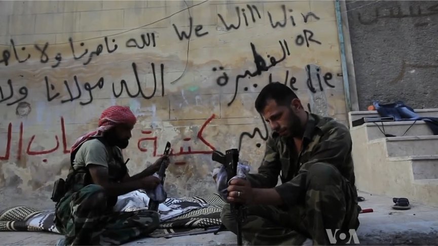 FSA rebels cleaning their AK47s in Aleppo, Syria during the civil war.
